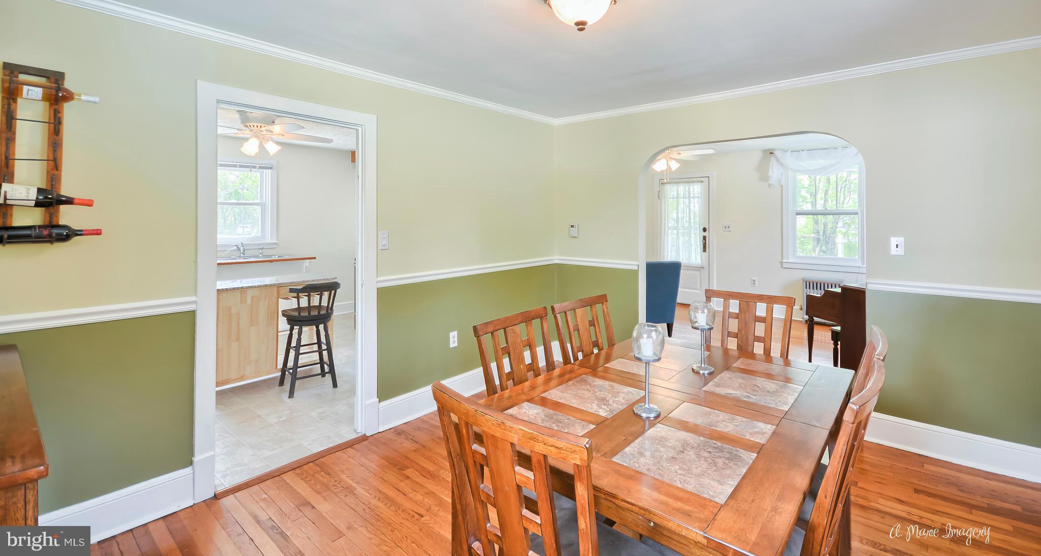 1651 Shookstown Road Frederick, MD 21702 - Photo 5 of 30 a view of a dining room with furniture and wooden floor