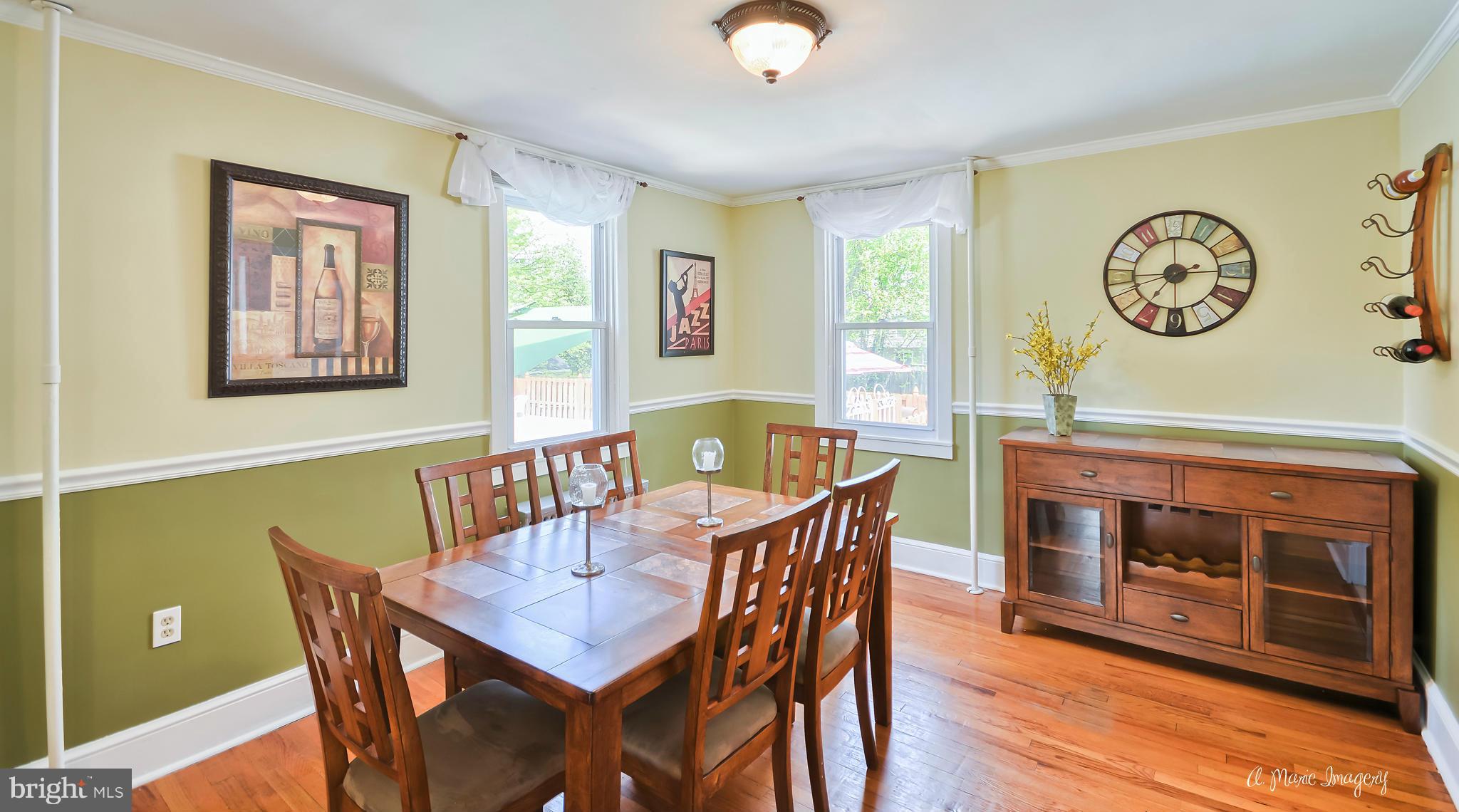 1651 Shookstown Road Frederick, MD 21702 - Photo 6 of 30 a view of a dining room with furniture wooden floor and a fireplace