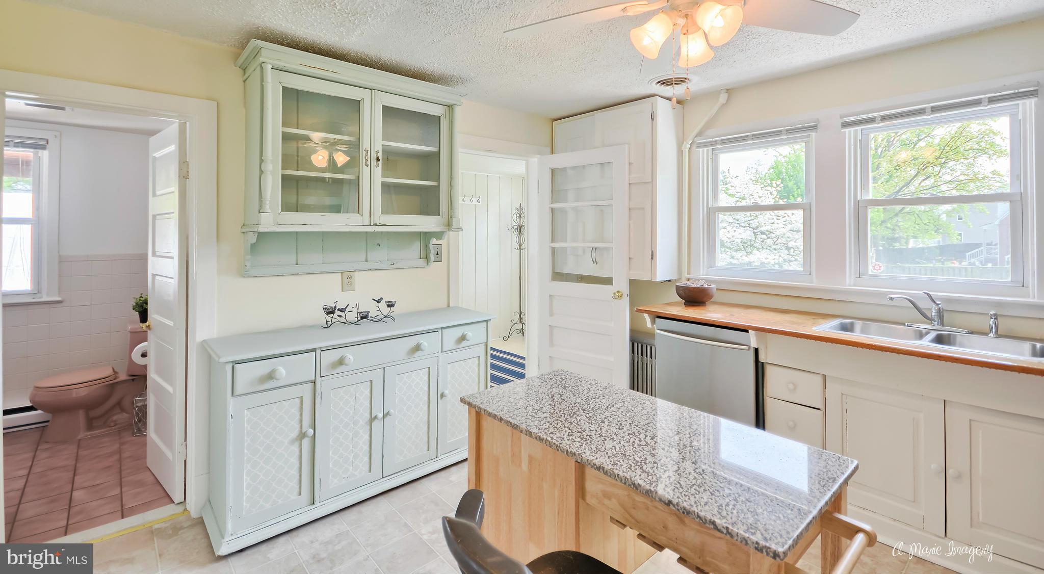 1651 Shookstown Road Frederick, MD 21702 - Photo 9 of 30 a kitchen with a sink stove and cabinets