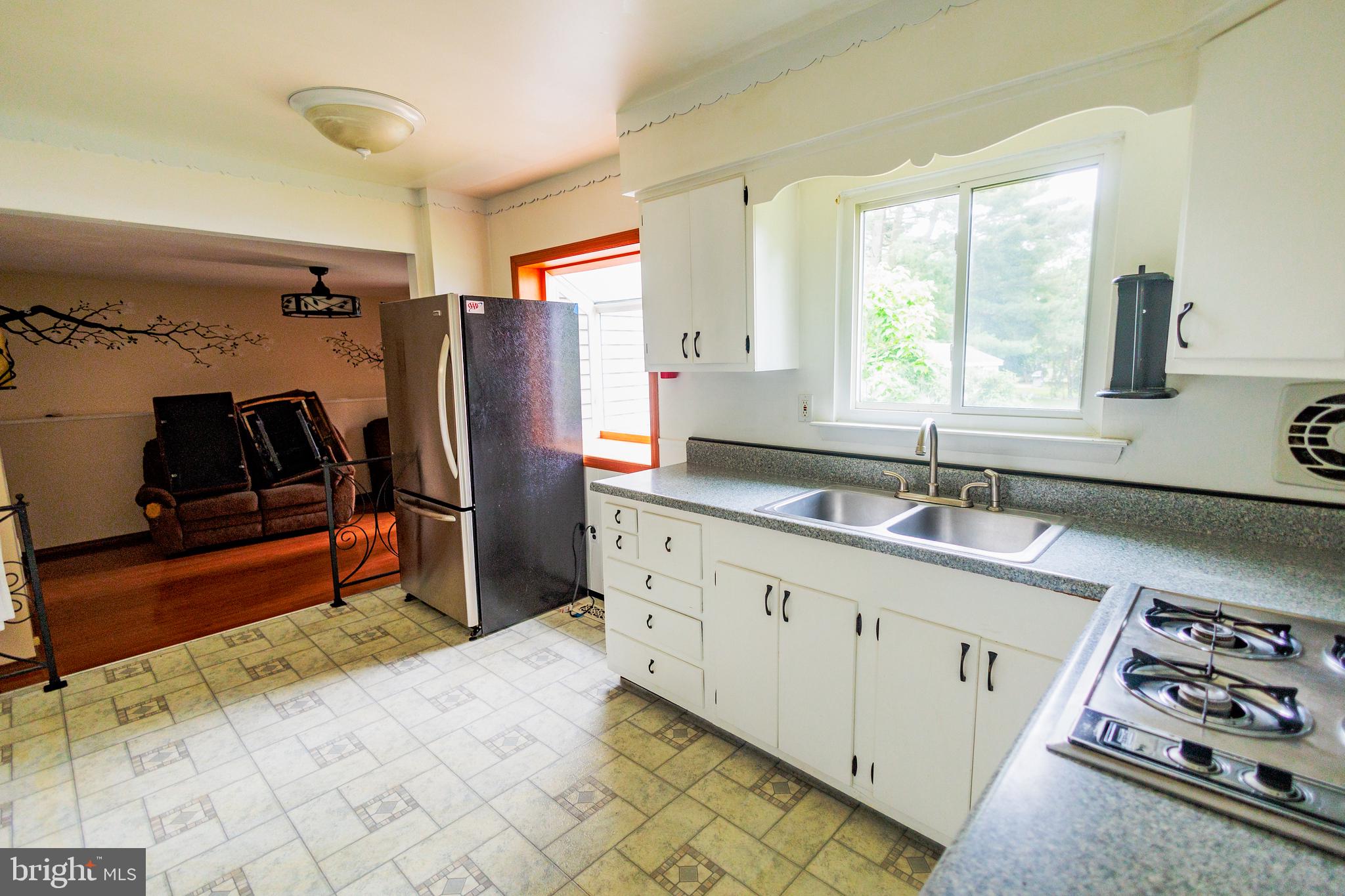 300 Macclelland Avenue Glassboro, NJ 08028 - Photo 17 of 39 a kitchen that has a sink a stove and a refrigerator