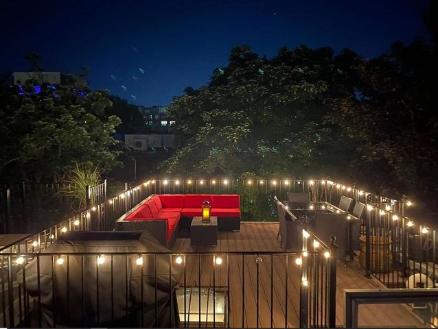 a view of a balcony with sitting area