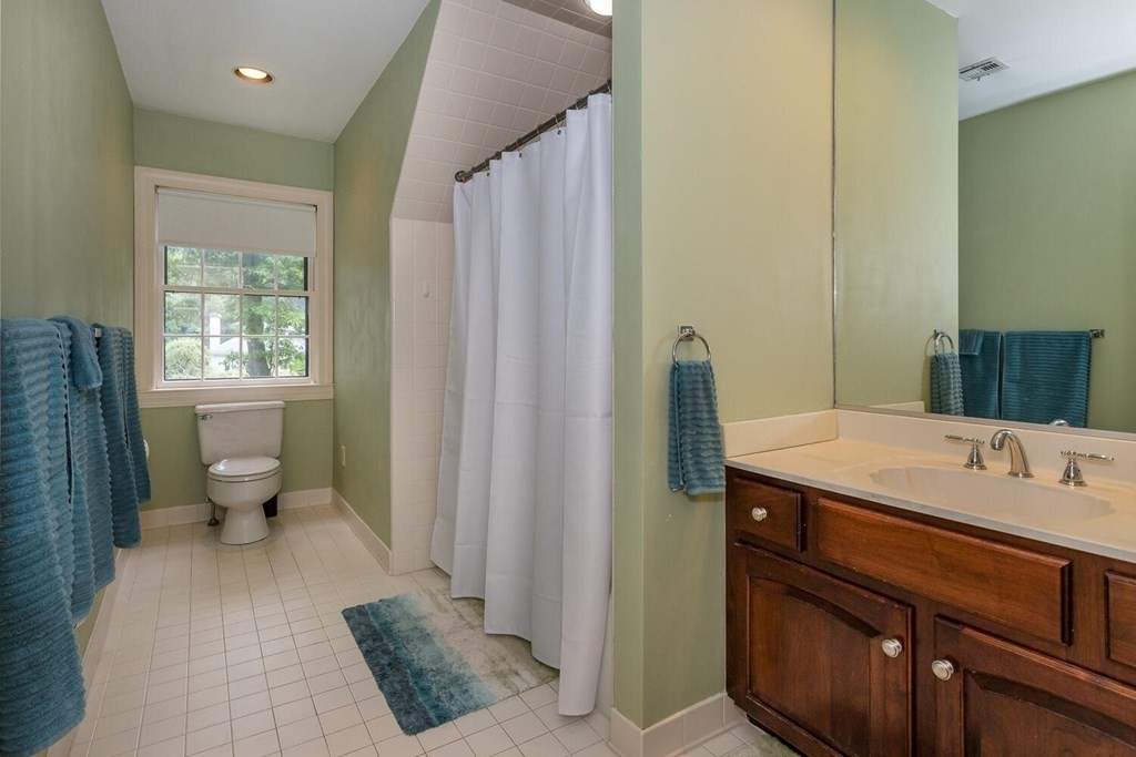 30 Raven Road Canton, MA 02021 - Photo 24 of 33 a spacious bathroom with a granite countertop sink a toilet and a mirror