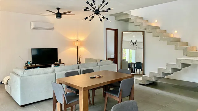 a view of a livingroom with furniture and a flat screen tv