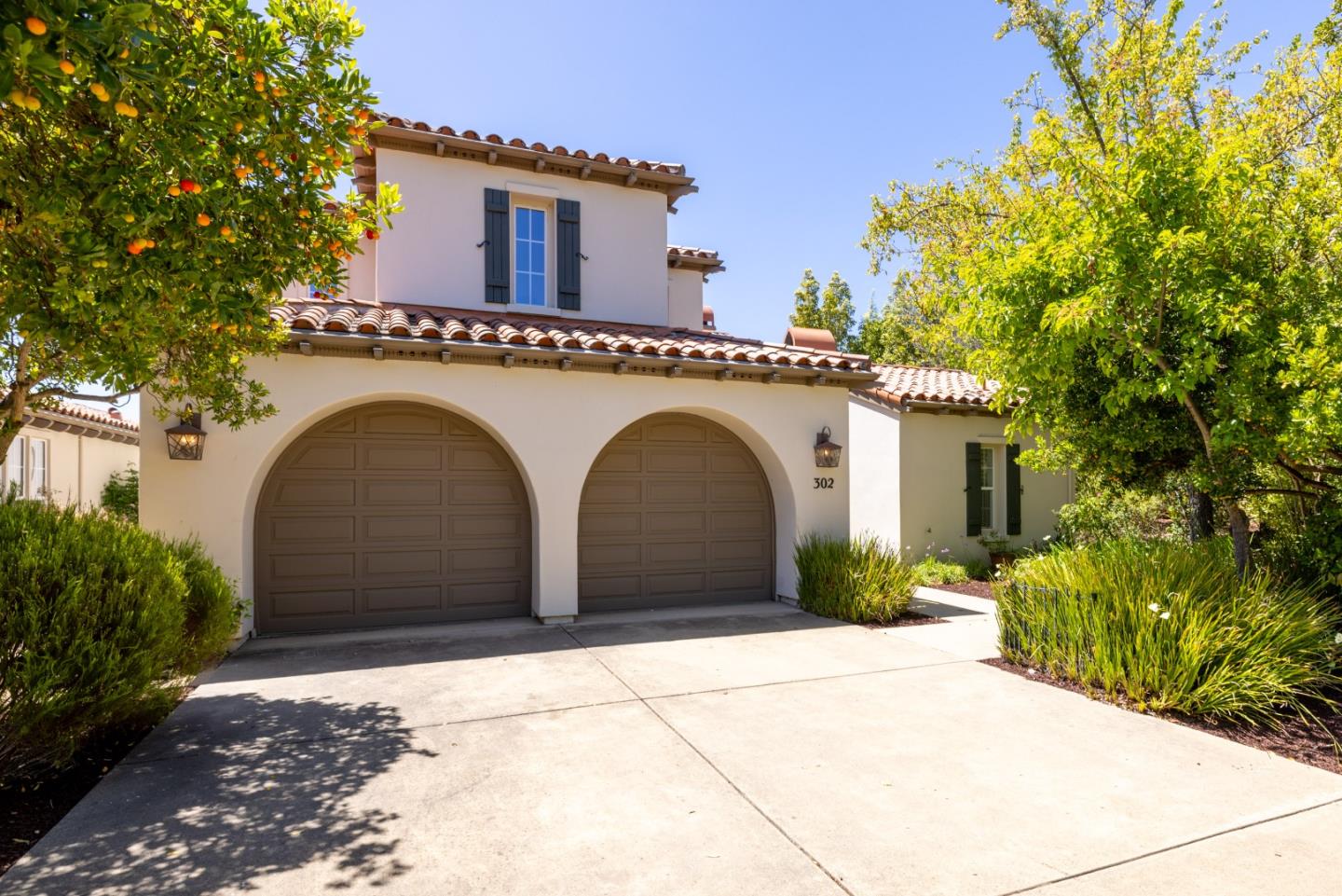 302 Pasadera Drive Monterey, CA 93940 - Photo 1 of 40 a front view of a house with a garden