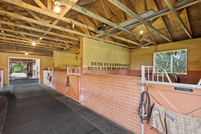 a view of a porch with wooden floor