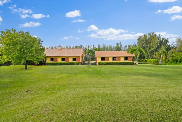 a view of a house with a big yard