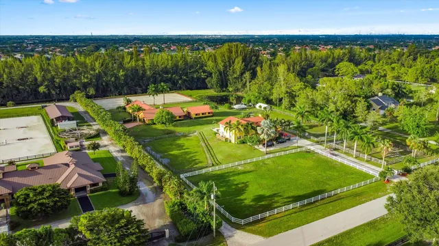 an aerial view of a golf course with swimming pool