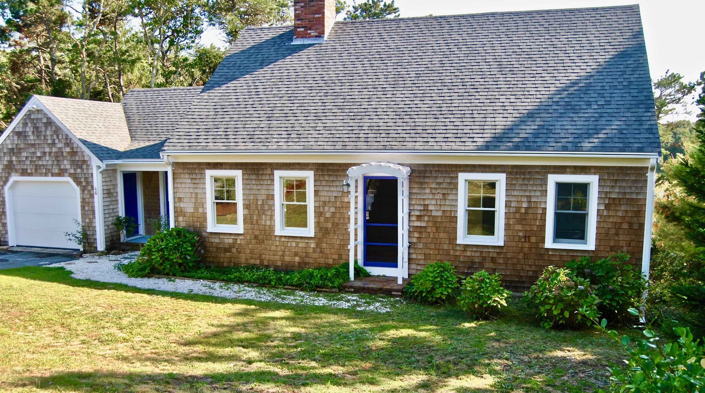 46 Partridge Path Chatham, MA 02633 - Photo 1 of 42 a front view of a house with a yard and outdoor seating