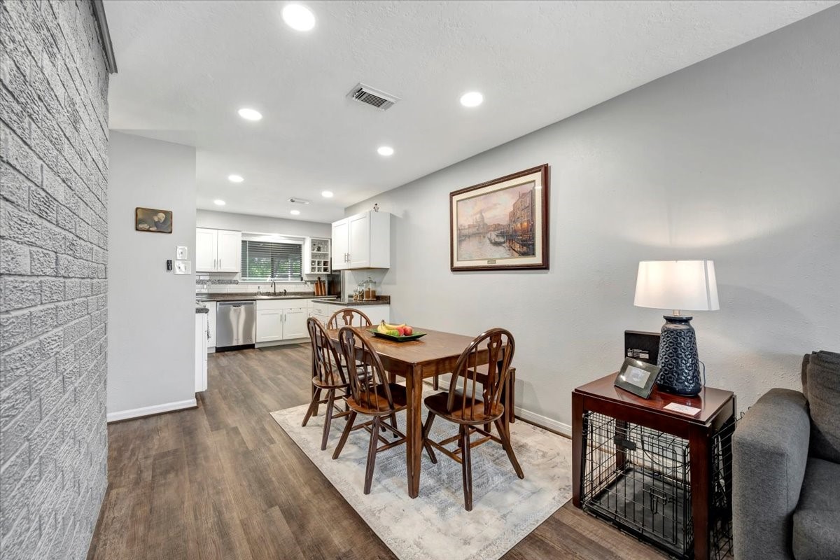 2610 Loganberry Circle Seabrook, TX 77586 - Photo 11 of 35 a view of a dining room with furniture and wooden floor