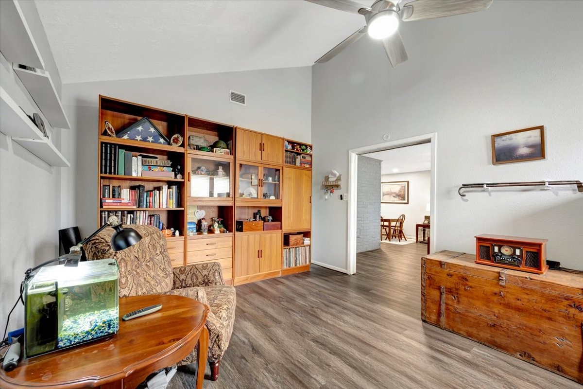 2610 Loganberry Circle Seabrook, TX 77586 - Photo 8 of 35 a living room with furniture and a book shelf