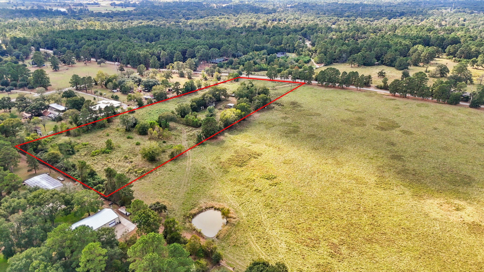 24904 Macedonia Road Hockley, TX 77447 - Photo 2 of 12 a view of a lake from a yard