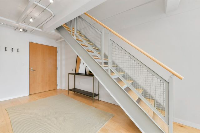 a bed room with a bed window and a table