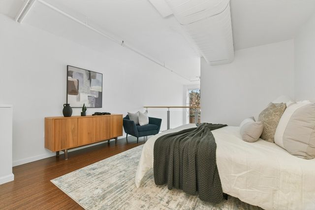 a bathroom with a granite countertop sink mirror and toilet