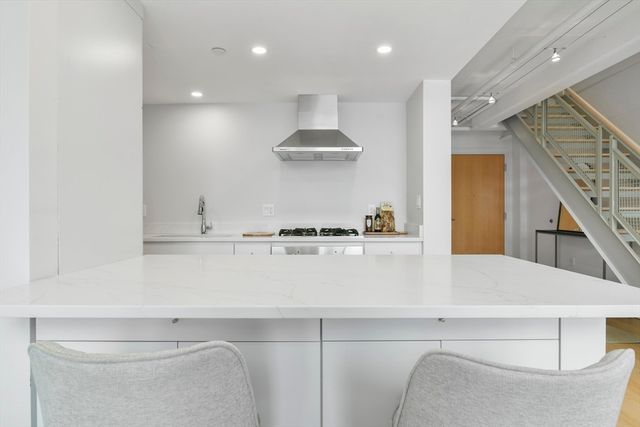 a kitchen with furniture and a table