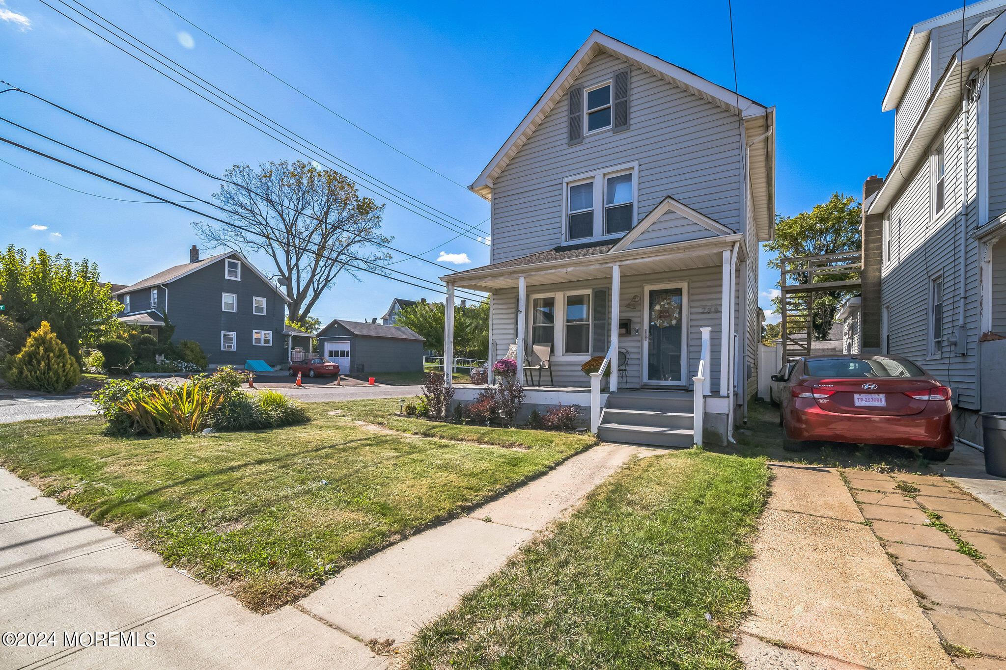 238 Branchport Avenue Long Branch, NJ 07740 - Photo 1 of 42 a front view of a house with a garden and patio