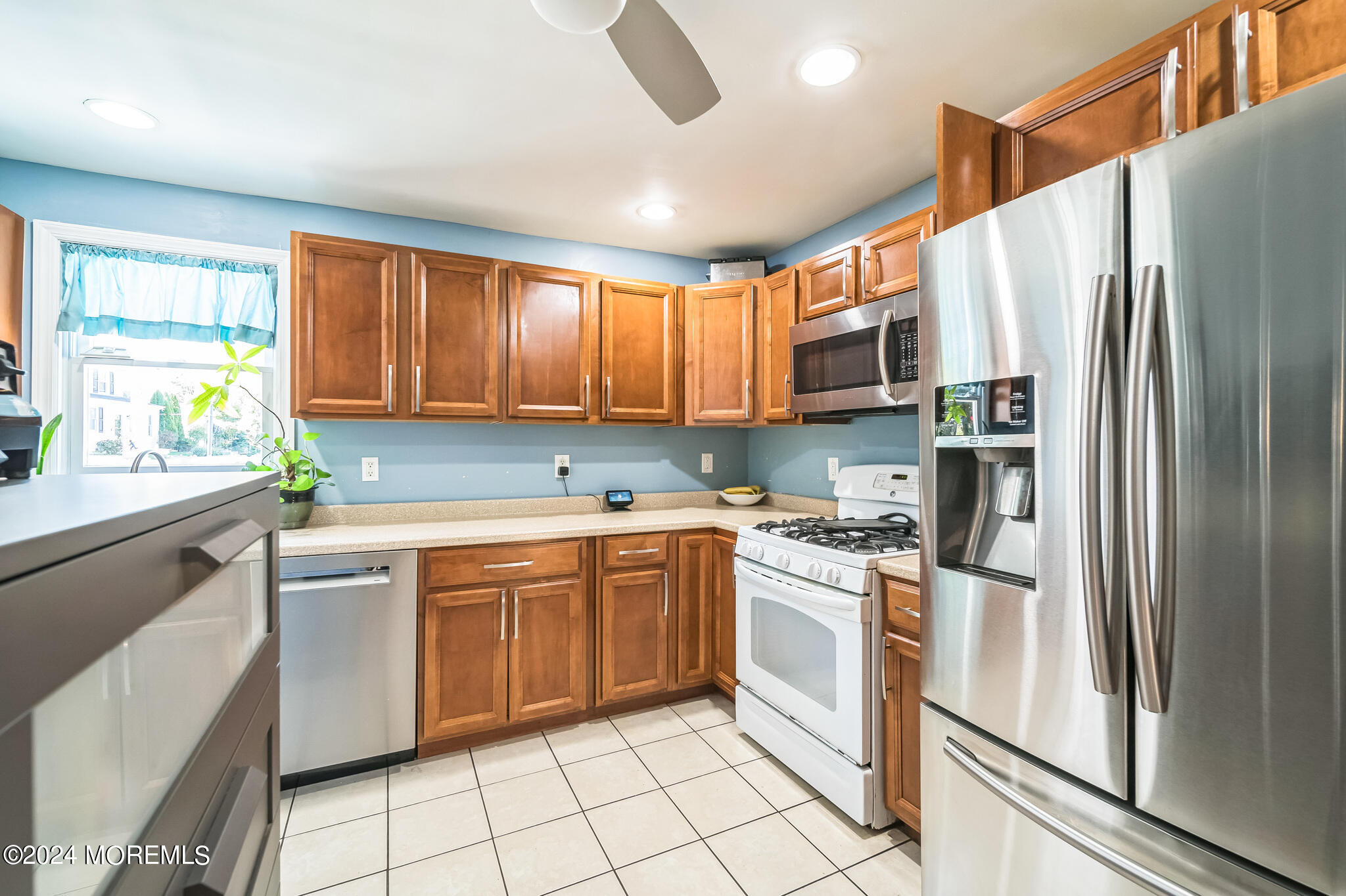 238 Branchport Avenue Long Branch, NJ 07740 - Photo 13 of 42 a kitchen with stainless steel appliances granite countertop a refrigerator and a stove top oven