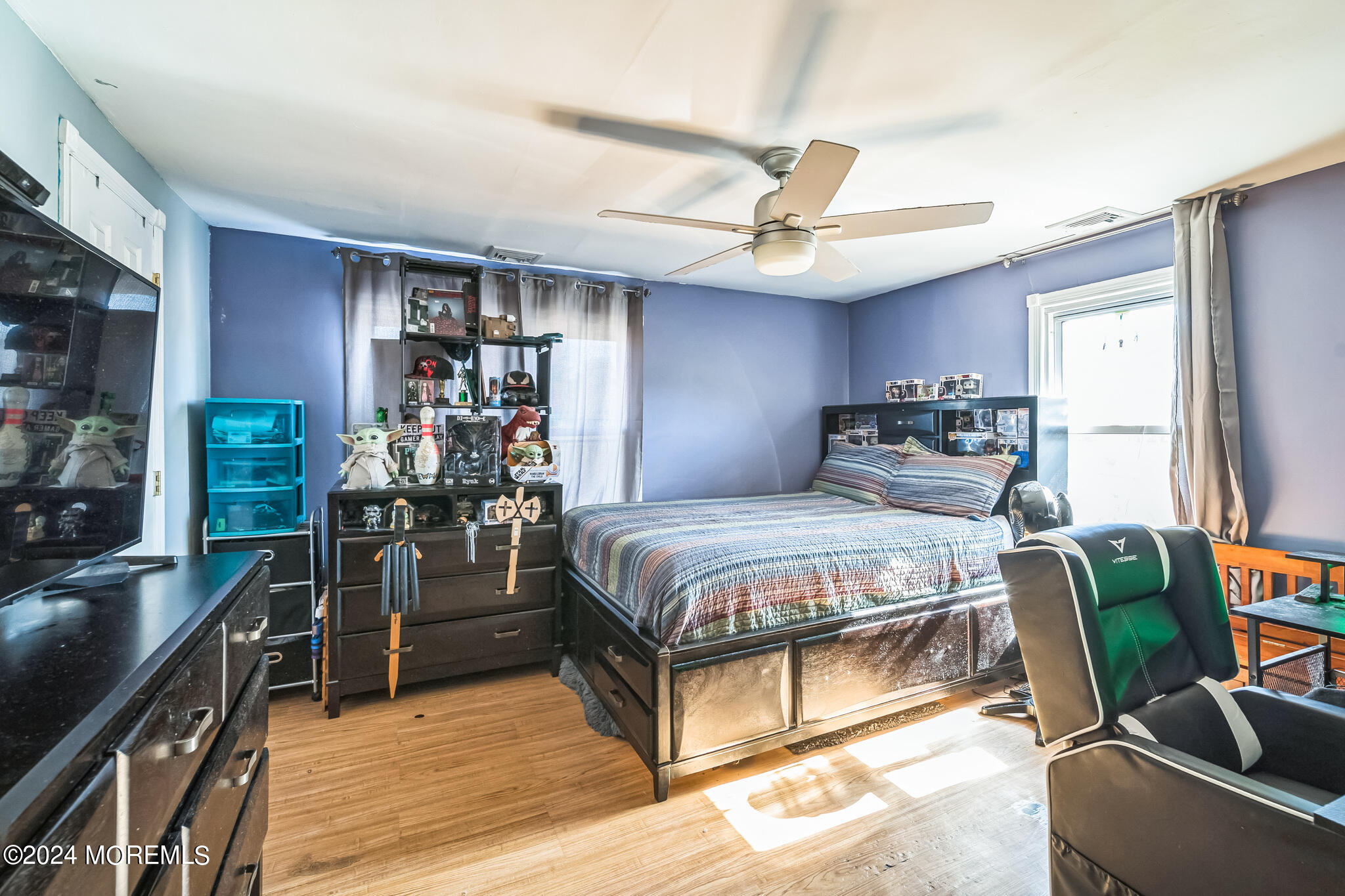 238 Branchport Avenue Long Branch, NJ 07740 - Photo 18 of 42 a bedroom with a bed closet and a window