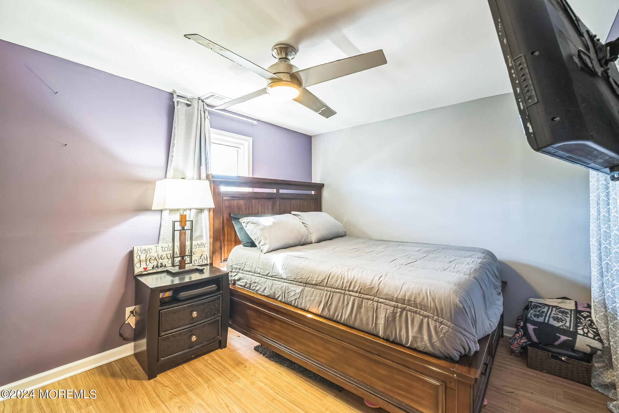 238 Branchport Avenue Long Branch, NJ 07740 - Photo 20 of 42 a bedroom with a bed and ceiling fan