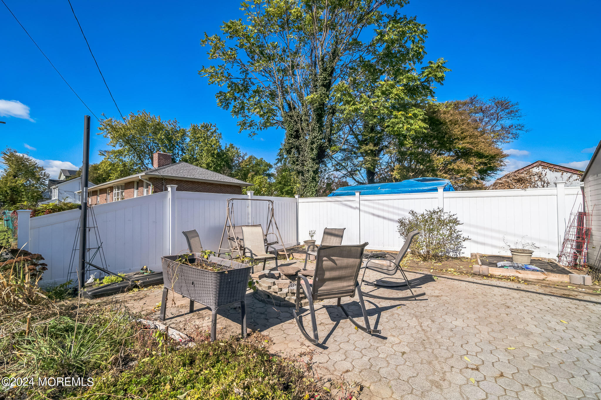 238 Branchport Avenue Long Branch, NJ 07740 - Photo 25 of 42 a view of a patio with table and chairs and potted plants