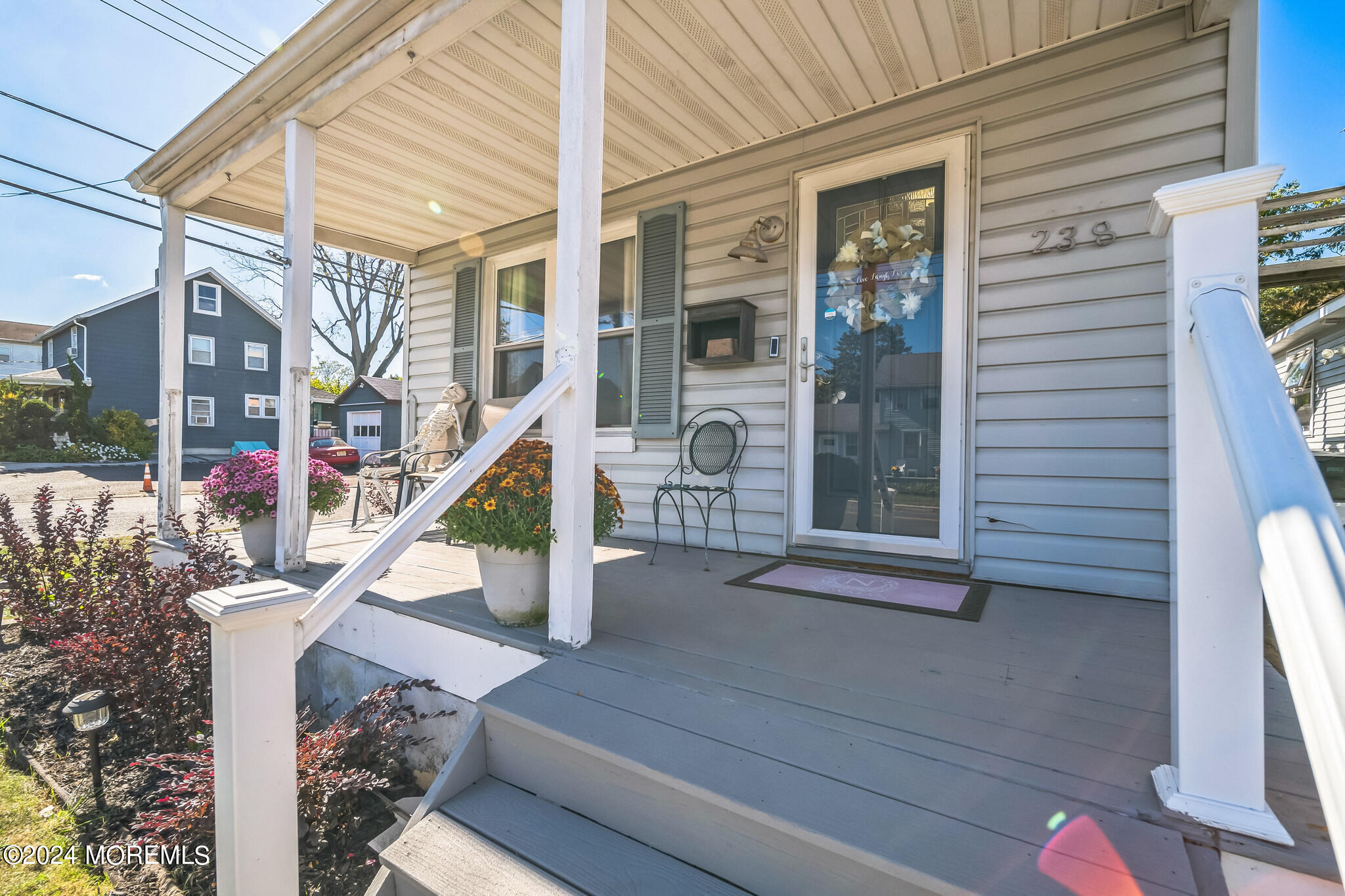 238 Branchport Avenue Long Branch, NJ 07740 - Photo 5 of 42 a front view of a house with large trees