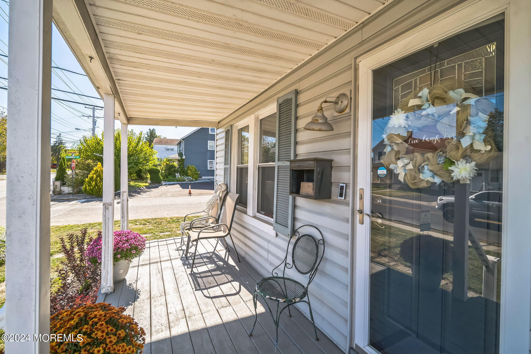 238 Branchport Avenue Long Branch, NJ 07740 - Photo 6 of 42 a view of a porch with chairs and backyard