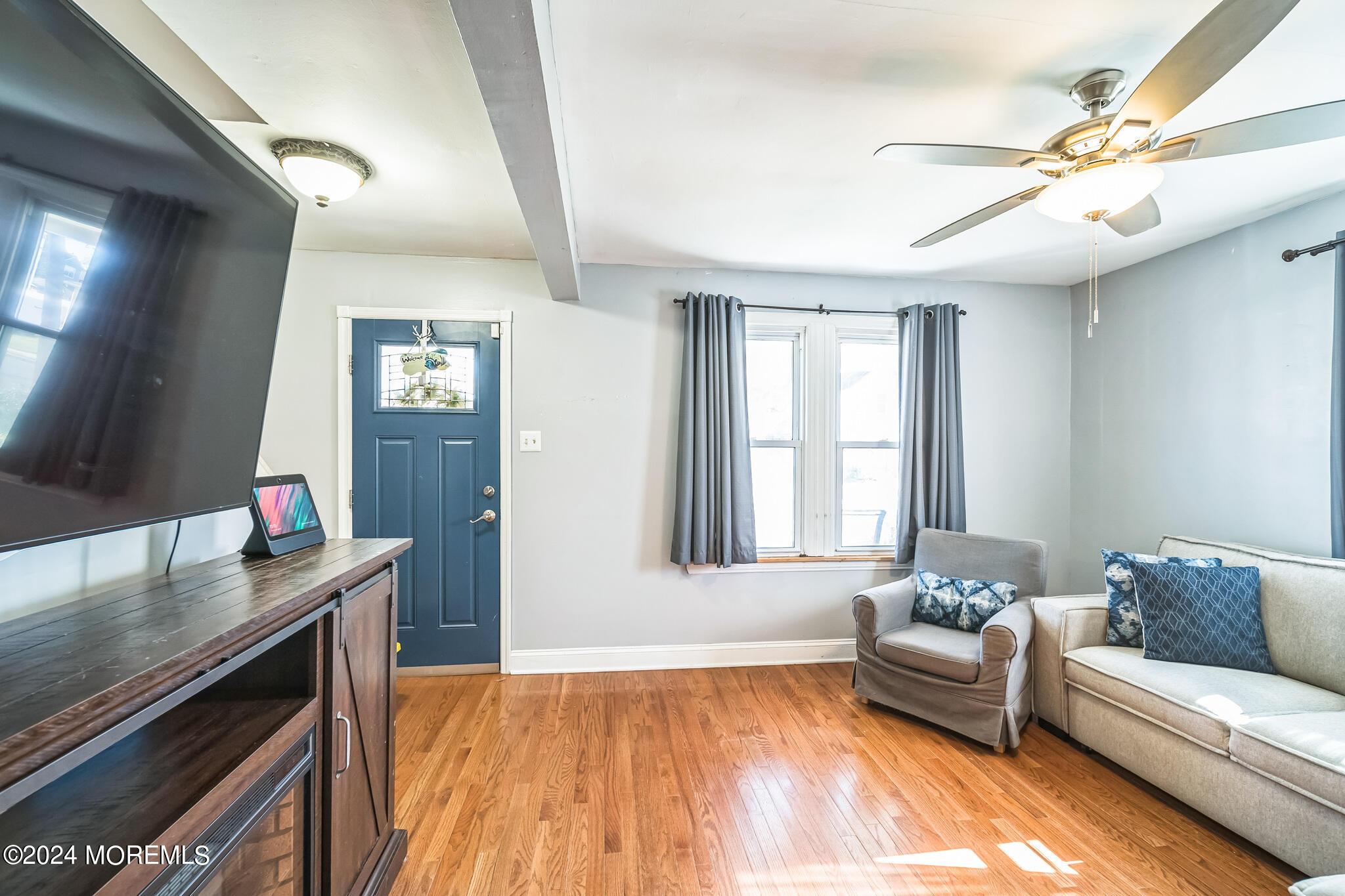238 Branchport Avenue Long Branch, NJ 07740 - Photo 8 of 42 a living room with furniture and a flat screen tv