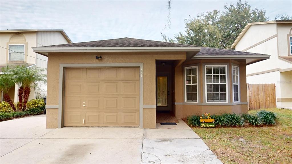 727 School House Road Lakeland, FL 33813 - Photo 1 of 1 a front view of a house with a yard