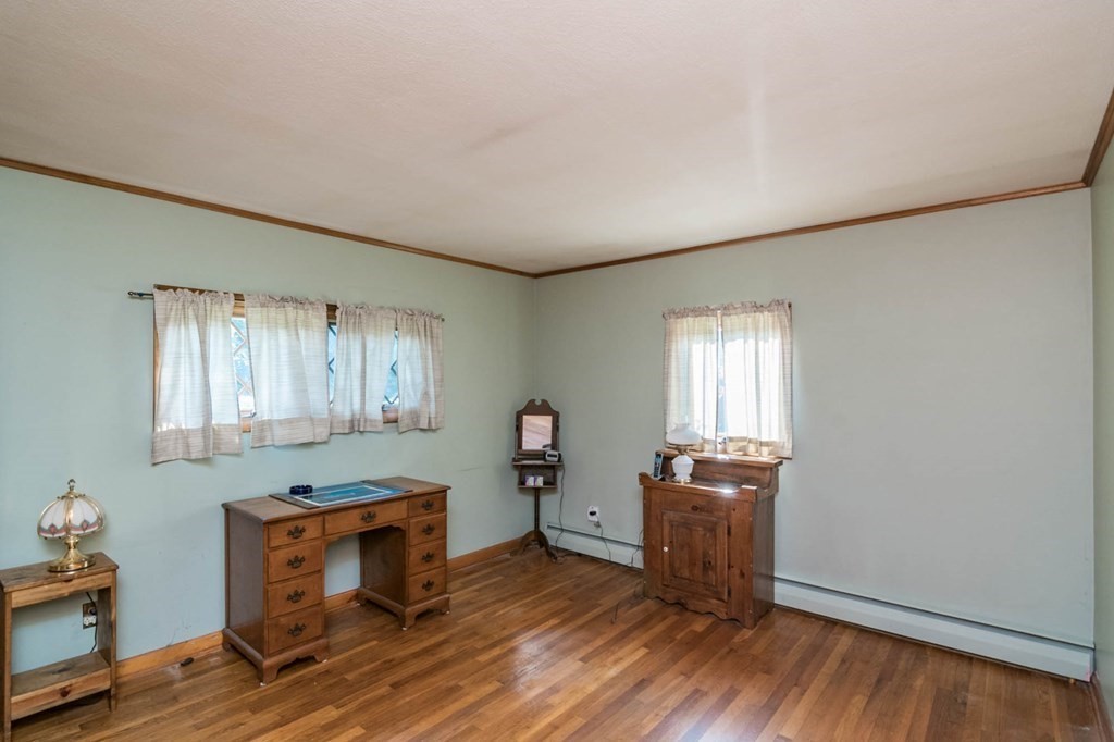 401 Stapleton Road Springfield, MA 01109 - Photo 14 of 35 a room with furniture and wooden floor