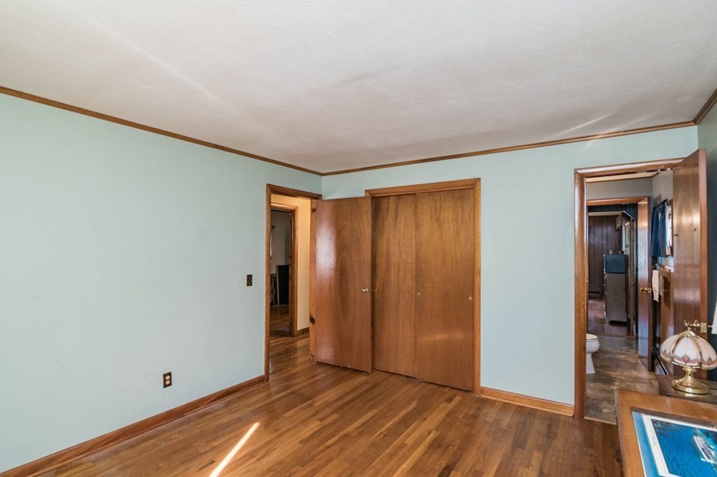 401 Stapleton Road Springfield, MA 01109 - Photo 15 of 35 an empty room with wooden floor and closet