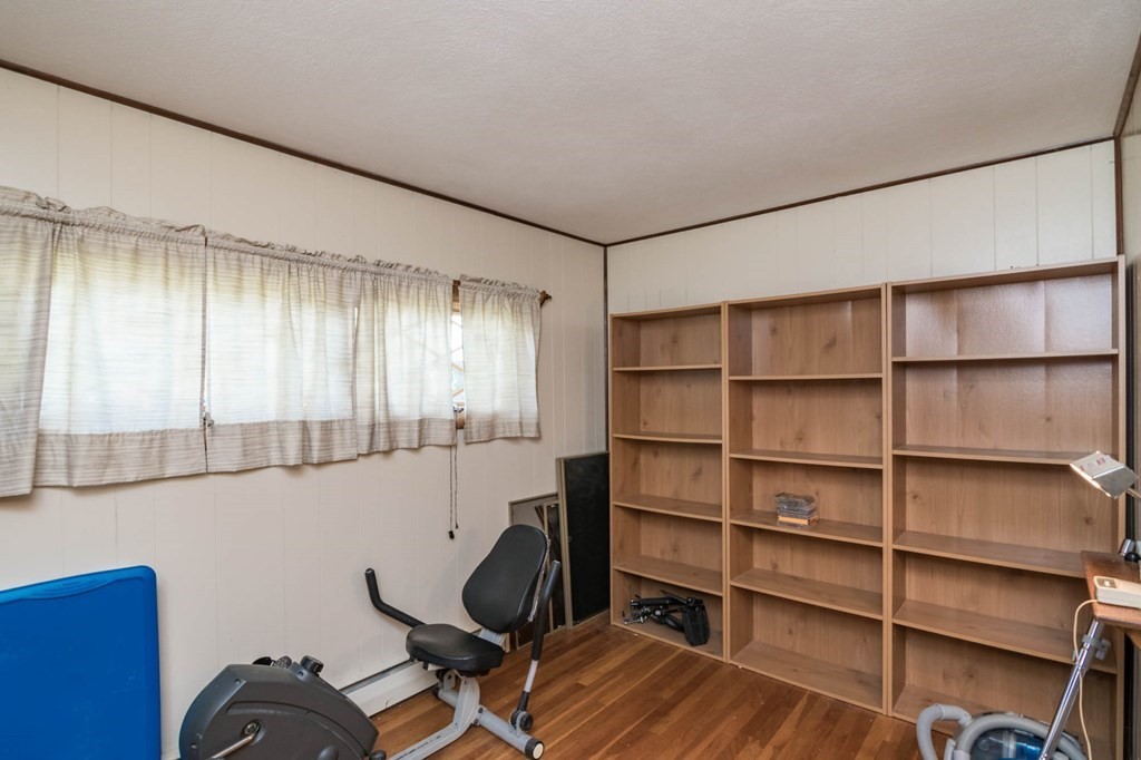 401 Stapleton Road Springfield, MA 01109 - Photo 18 of 35 a view of a workspace with furniture and a window