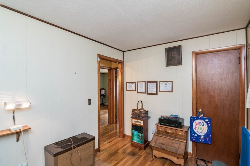 401 Stapleton Road Springfield, MA 01109 - Photo 19 of 35 a living room with furniture and a wooden floor