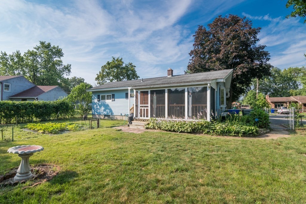 401 Stapleton Road Springfield, MA 01109 - Photo 31 of 35 a front view of house with a garden and porch