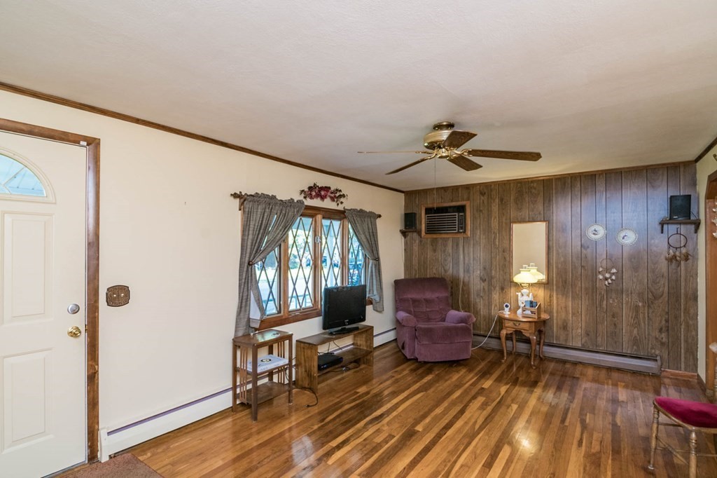 401 Stapleton Road Springfield, MA 01109 - Photo 7 of 35 a living room with furniture and a wooden floor