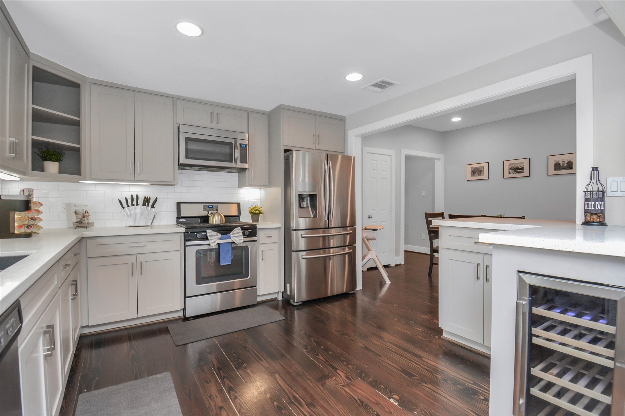 5705 Cochran Street Houston, TX 77009 - Photo 13 of 34 a kitchen with a refrigerator stove and sink
