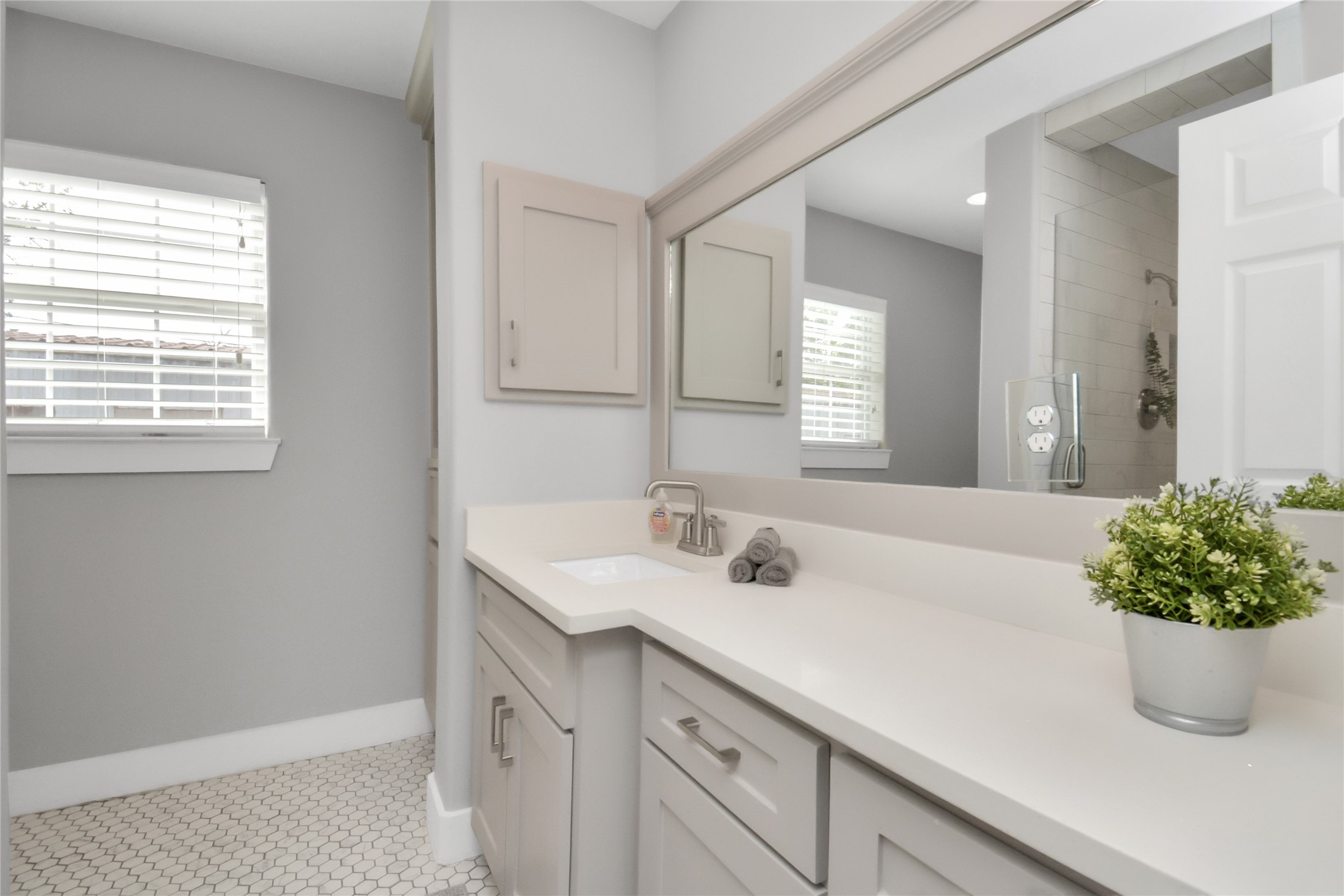 5705 Cochran Street Houston, TX 77009 - Photo 23 of 34 a bathroom with a sink a vanity and a mirror