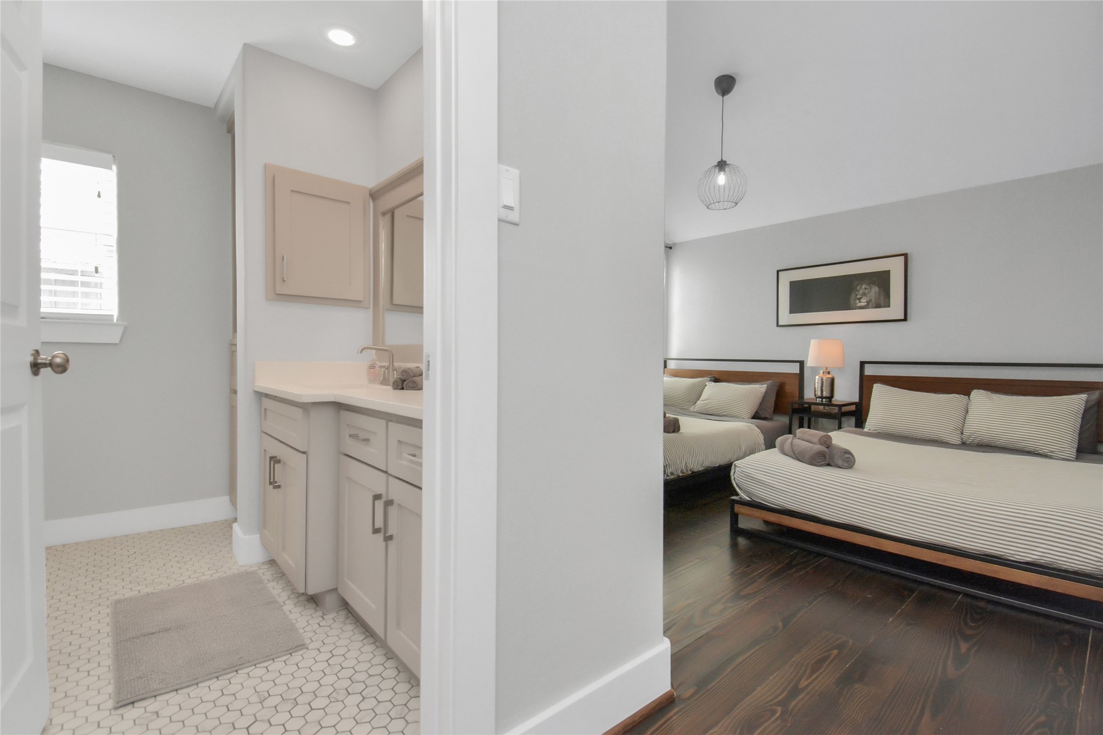 5705 Cochran Street Houston, TX 77009 - Photo 26 of 34 a spacious bedroom with a bed and a couch