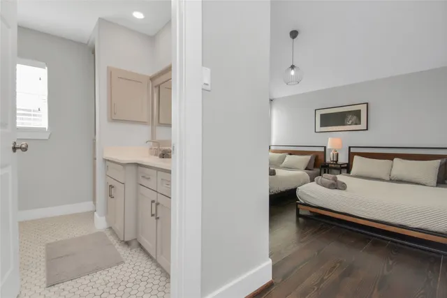 a spacious bedroom with a bed and a couch