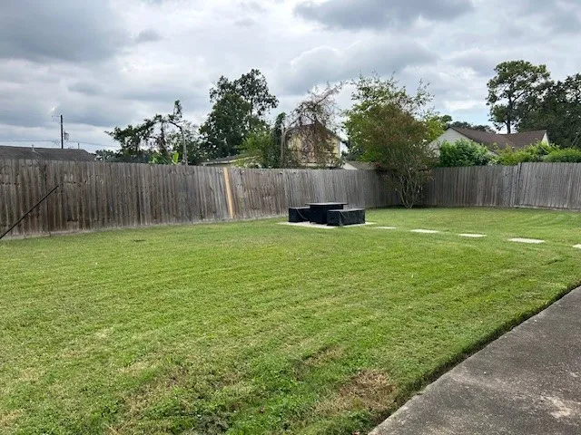 a swimming pool with a wooden fence
