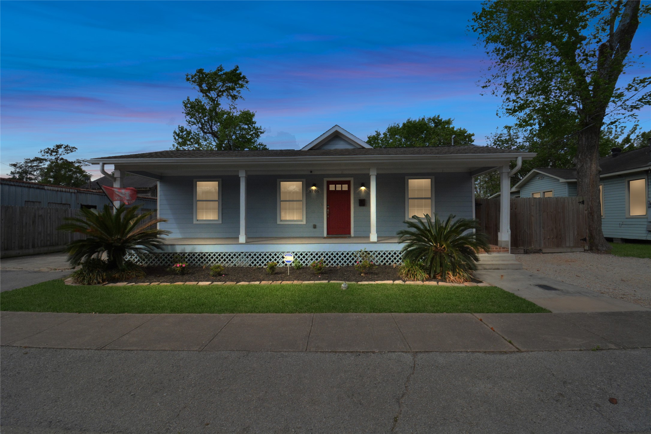 5705 Cochran Street Houston, TX 77009 - Photo 4 of 34 a front view of a house with a yard