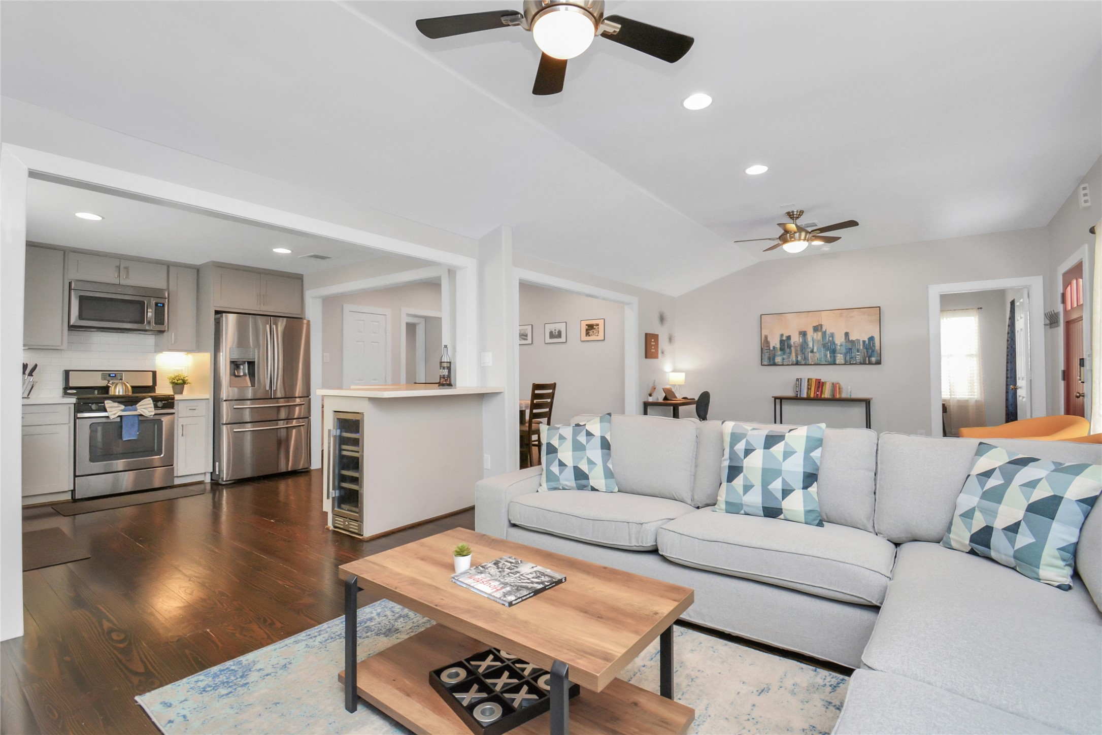 5705 Cochran Street Houston, TX 77009 - Photo 6 of 34 a living room with furniture and a wooden floor