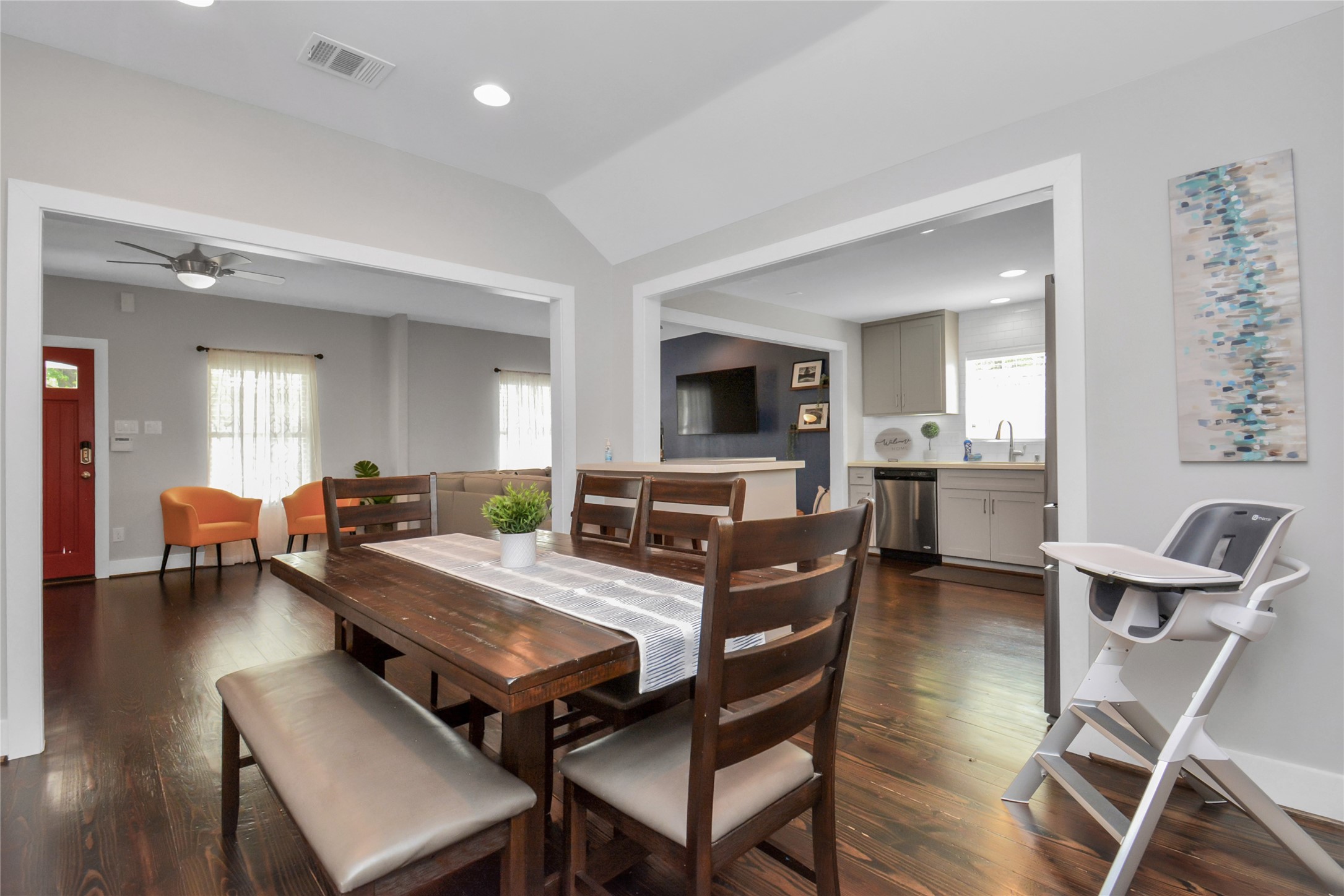 5705 Cochran Street Houston, TX 77009 - Photo 10 of 34 a living room with furniture a dining table and chairs