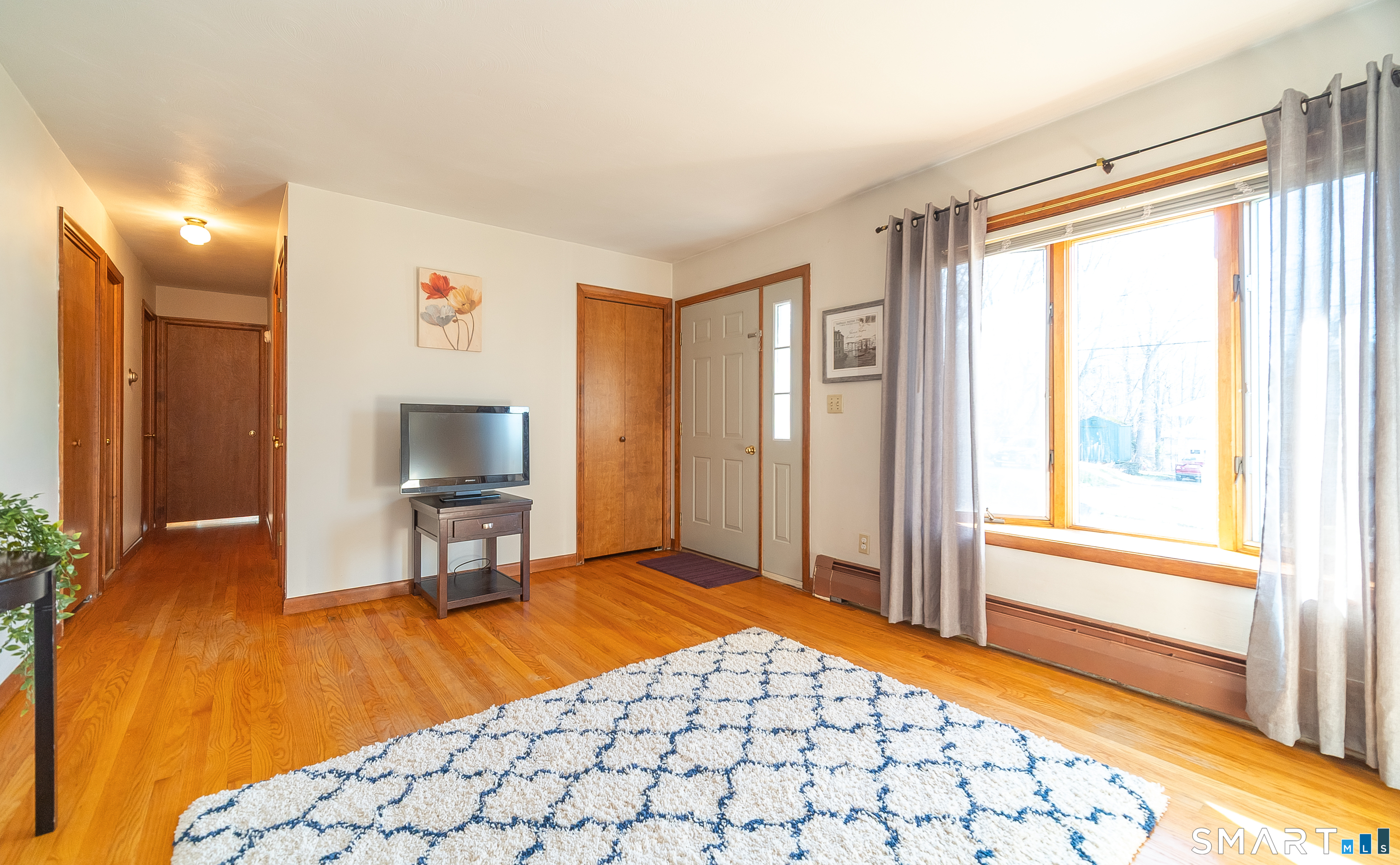 20 Prospect Street Middletown, CT 06457 - Photo 15 of 30 a living room with a bed furniture and a large window