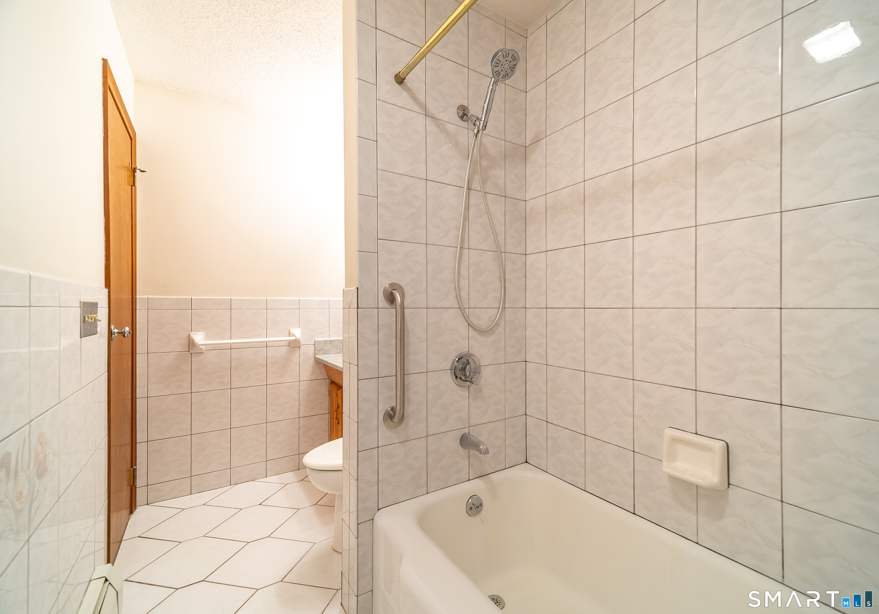 20 Prospect Street Middletown, CT 06457 - Photo 23 of 30 a bathroom with a bathtub and toilet