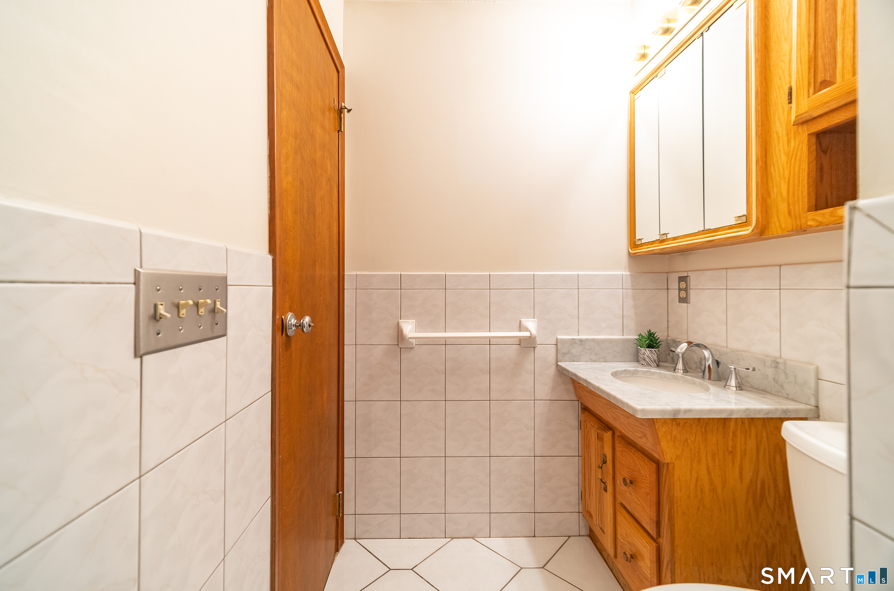 20 Prospect Street Middletown, CT 06457 - Photo 24 of 30 a bathroom with a sink and a mirror