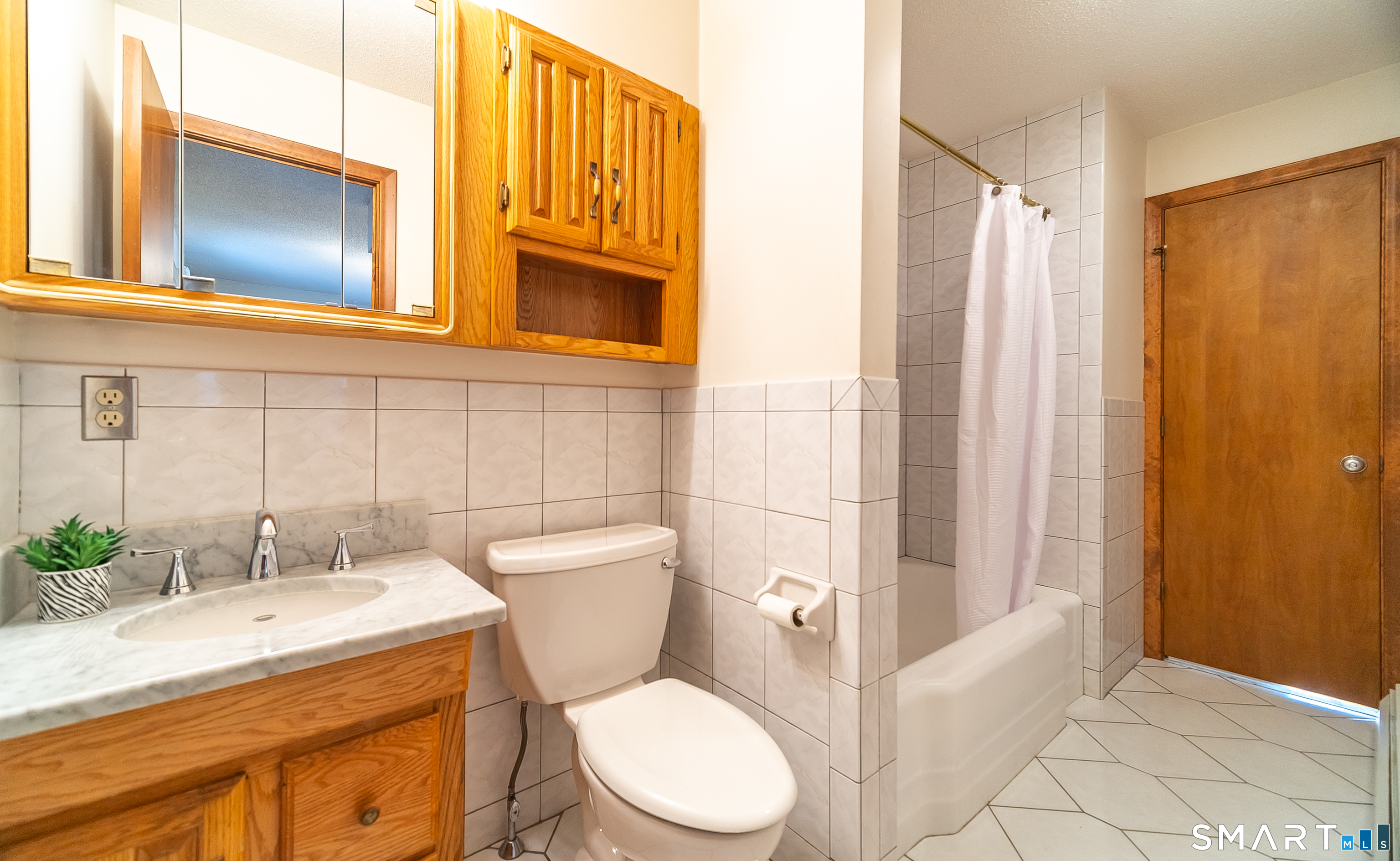 20 Prospect Street Middletown, CT 06457 - Photo 25 of 30 a bathroom with a granite countertop sink toilet and shower