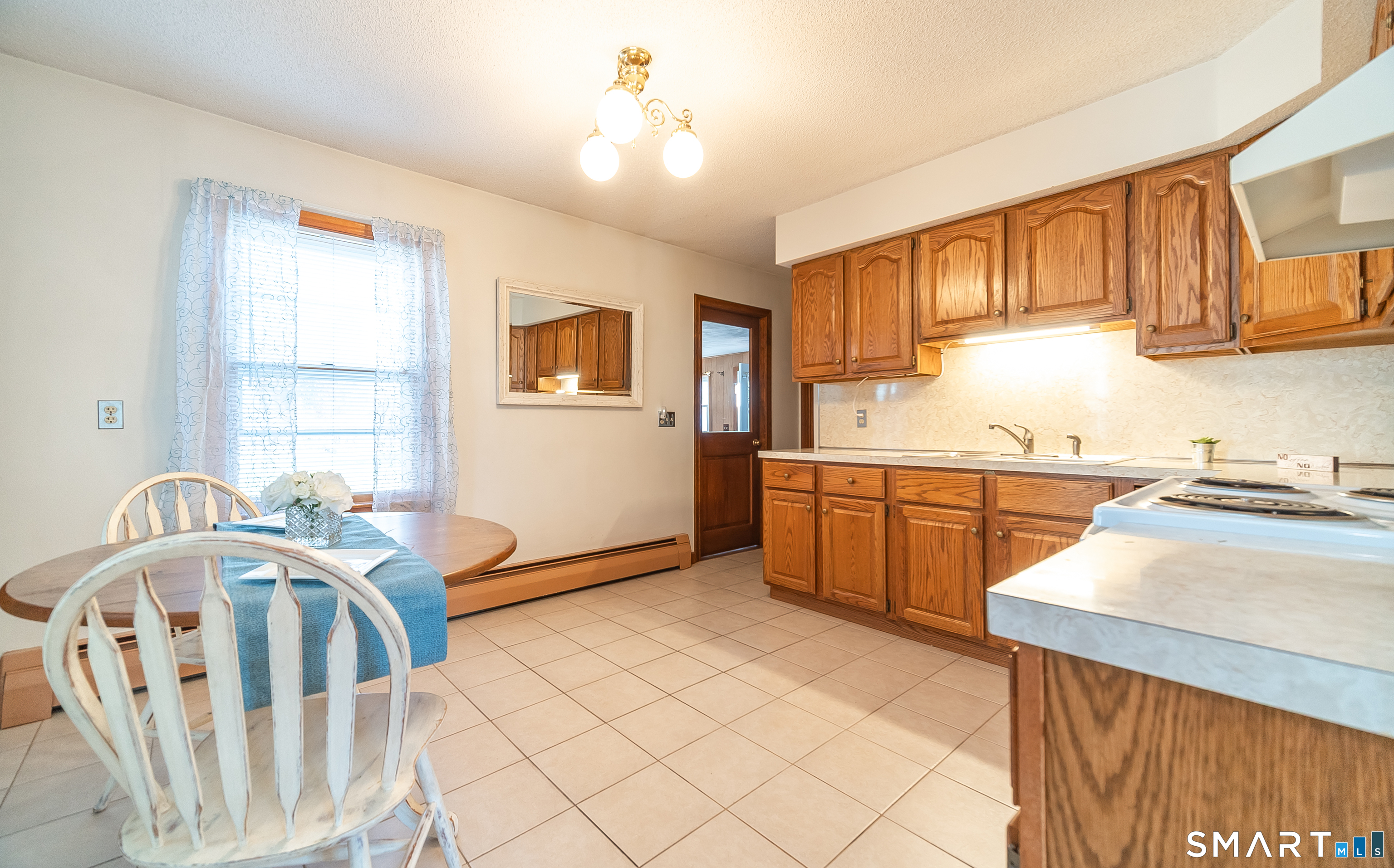 20 Prospect Street Middletown, CT 06457 - Photo 5 of 30 a kitchen that has a sink a window and stainless steel appliances