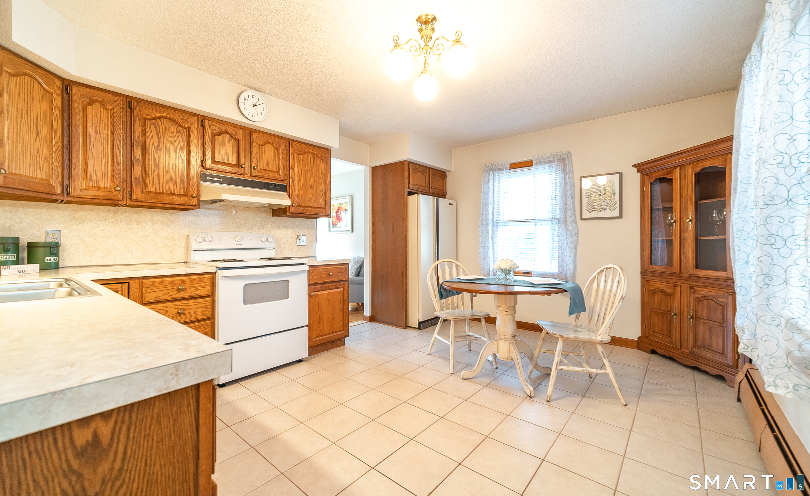 20 Prospect Street Middletown, CT 06457 - Photo 6 of 30 a kitchen with granite countertop cabinets and chairs