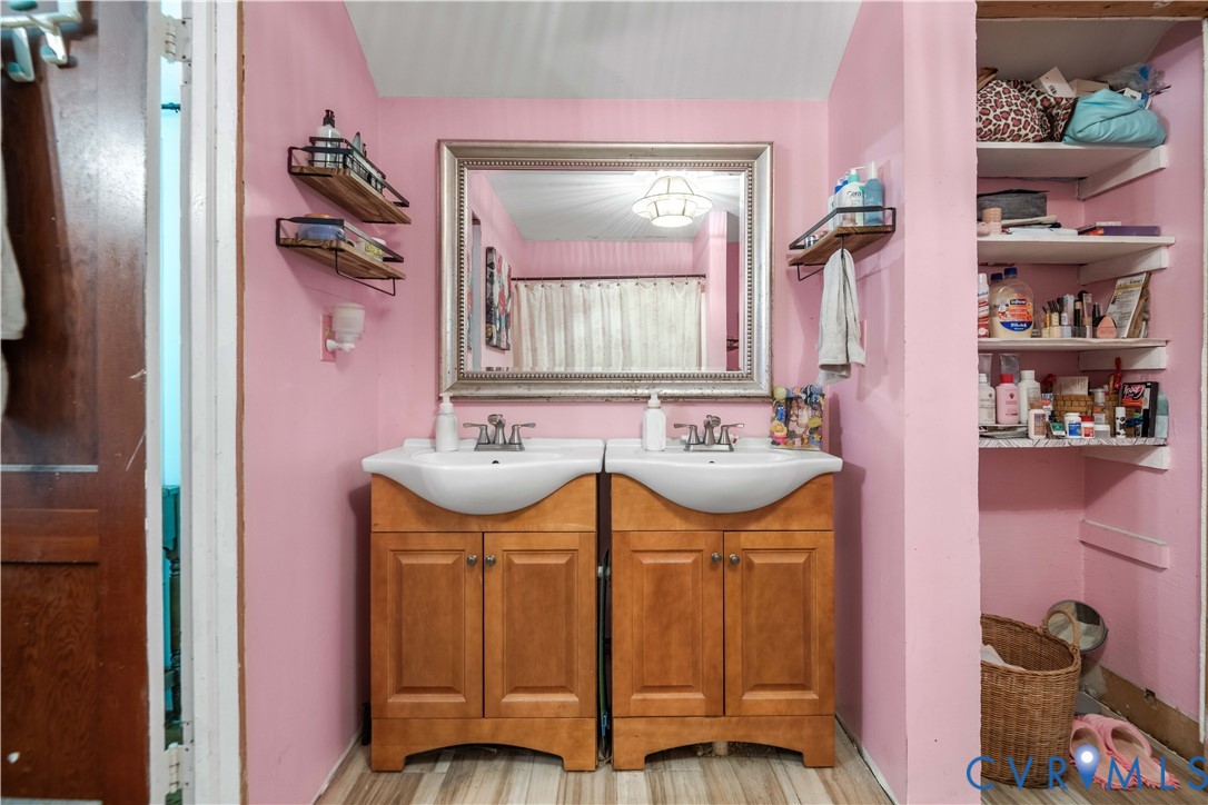6243 Studley Road Mechanicsville, VA 23116 - Photo 46 of 65 a bathroom with a sink and a mirror