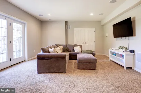 a kitchen with a table and chairs in it