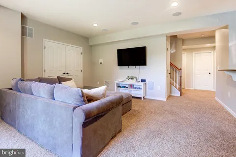 a bathroom with a double vanity sink mirror and toilet